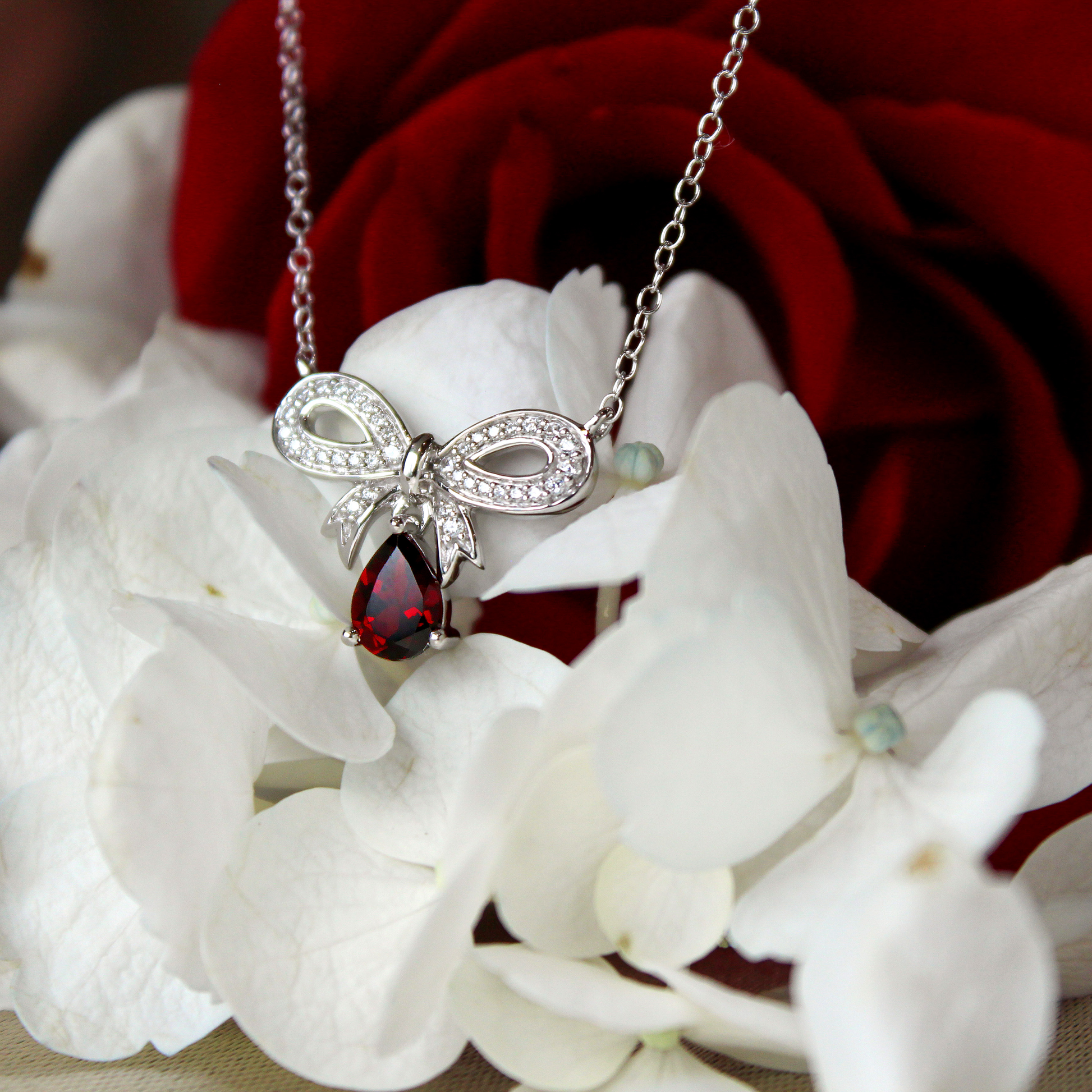Enchanted Disney Snow White 1/7 ct. tw. Diamond and Teardrop Garnet Necklace in Sterling Silver front view