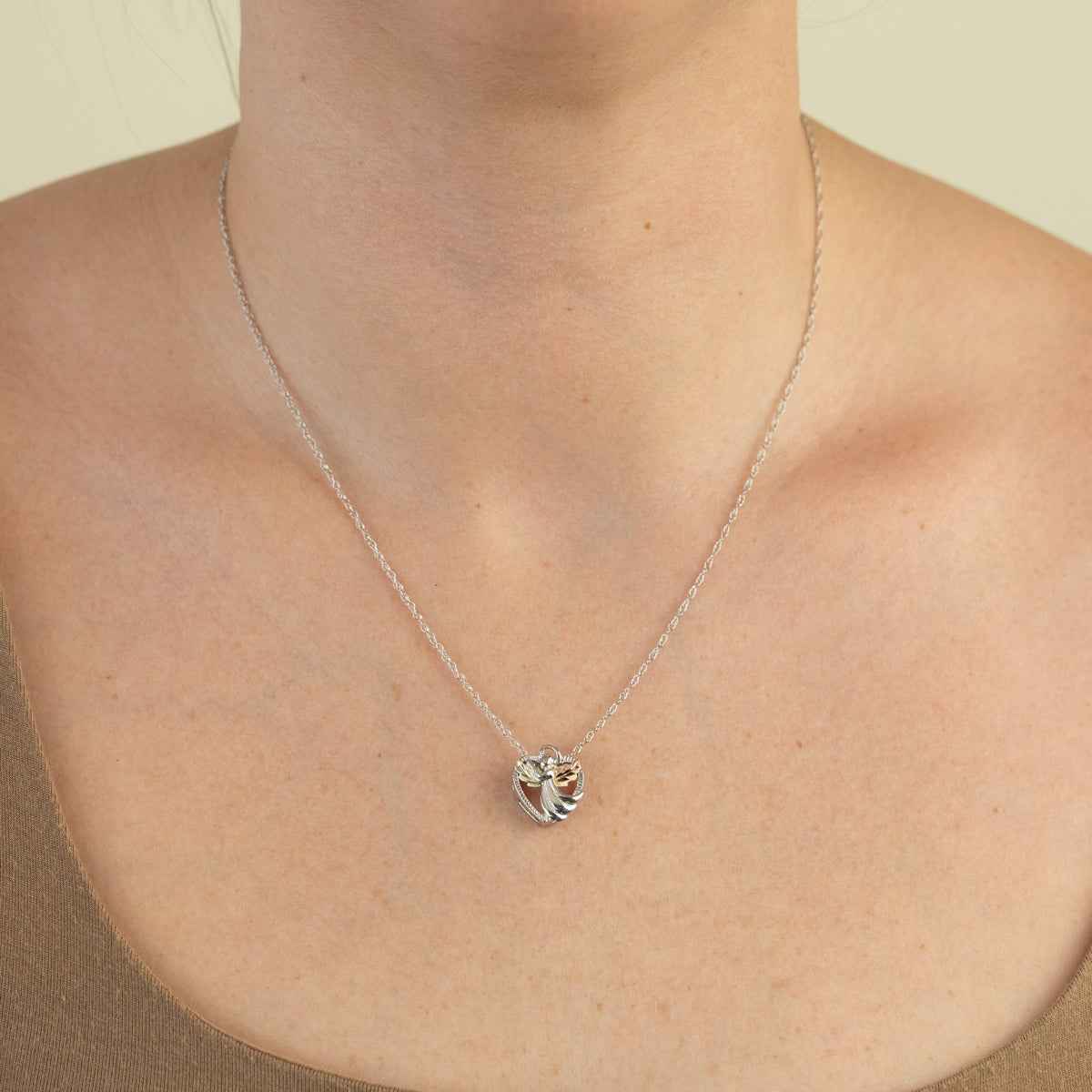 Black Hills Gold Pink & Green Leaf Winged Angel Heart Pendant in Sterling Silver front view