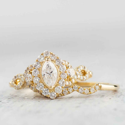 Natural 1-1/5 ct. tw. Marquise & Round Diamond Halo Twist Wedding Set in 14K Yellow Gold front view