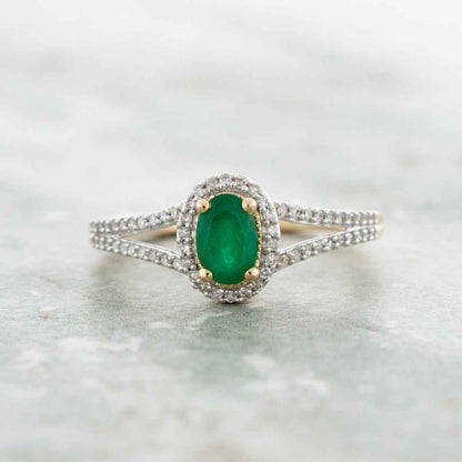 Green Oval Emerald and 1/6 ct. tw. Diamond Fashion Ring with Halo front view