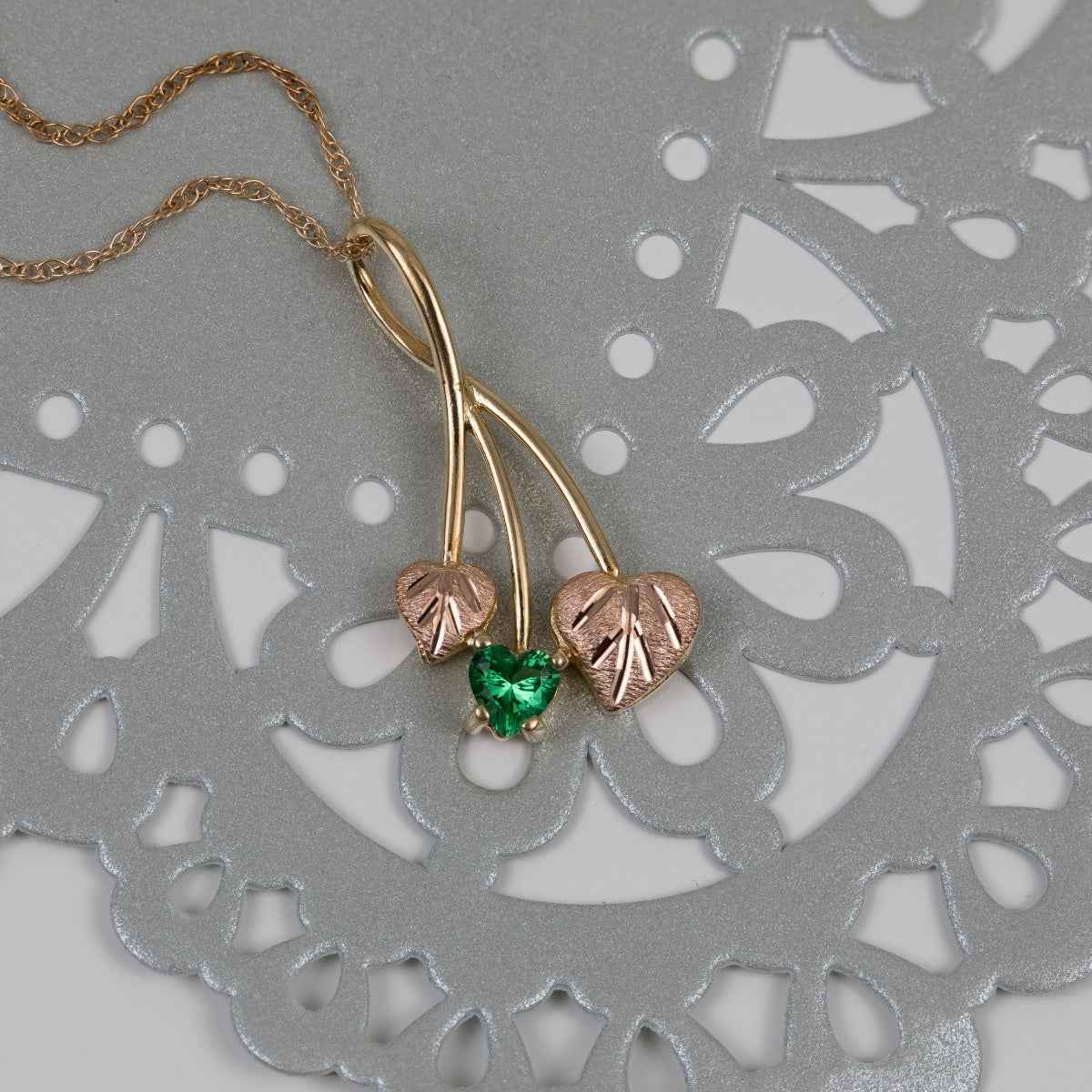 Black Hills Gold Heart Green Helenite & Double Pink Leaf Pendant in 10K Yellow Gold front view