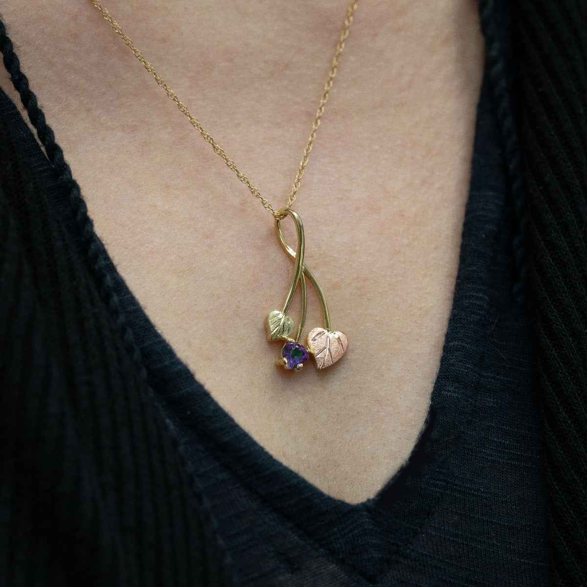 Black Hills Gold Heart Mystic Fire Topaz & Double Leaf Pendant in 10K Yellow Gold close-up detail