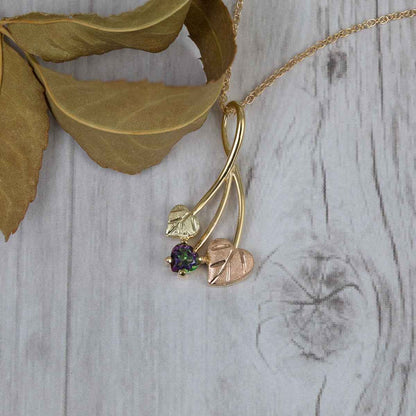 Black Hills Gold Heart Mystic Fire Topaz & Double Leaf Pendant in 10K Yellow Gold front view