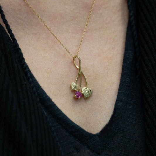 Black Hills Gold Created Heart Pink Sapphire & Double Green Leaf Pendant in 10K Yellow Gold close-up detail