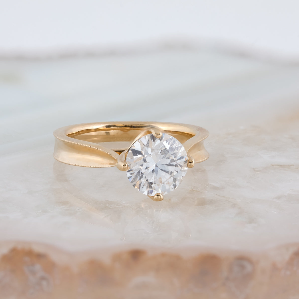 Canadian Rocks 2 ct. tw. Round Brilliant Diamond Solitaire Engagement Ring with Milgrain Edge Detailing in close-up detail