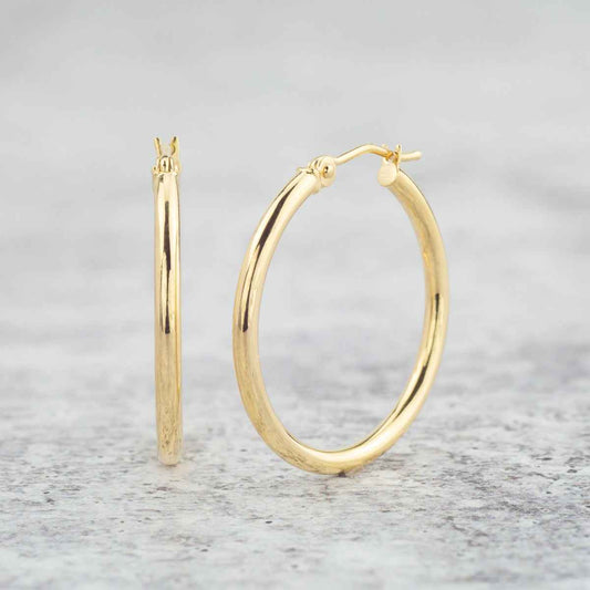 2x25mm Polished Hoop Earrings in 14K Yellow Gold front view