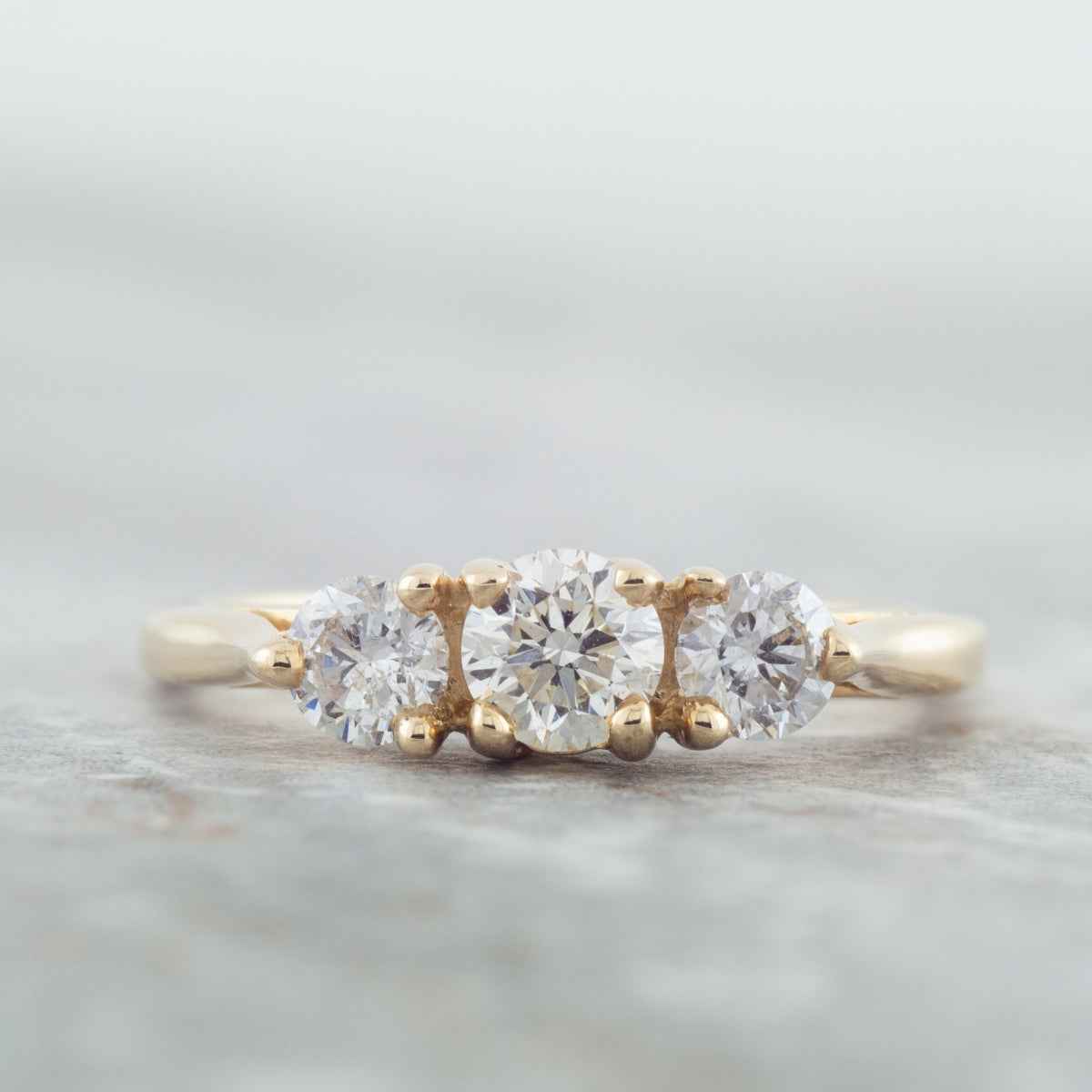 3/4 ct. tw. Round Brilliant Diamond 3-Stone Anniversary Ring in 14K Yellow Gold close-up detail