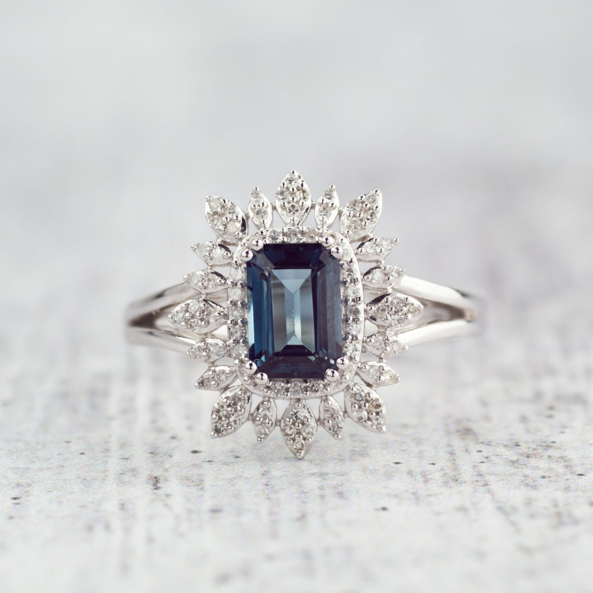 Emerald Cut London Blue Topaz & 1/5 ct. tw. Diamond Starburst Halo Ring 10K White Gold close-up detail