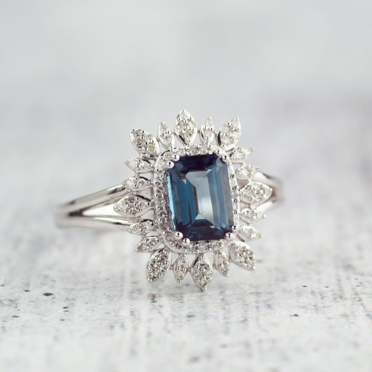 Emerald Cut London Blue Topaz & 1/5 ct. tw. Diamond Starburst Halo Ring 10K White Gold side profile
