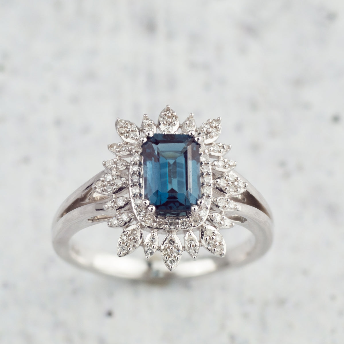 Emerald Cut London Blue Topaz & 1/5 ct. tw. Diamond Starburst Halo Ring 10K White Gold full view
