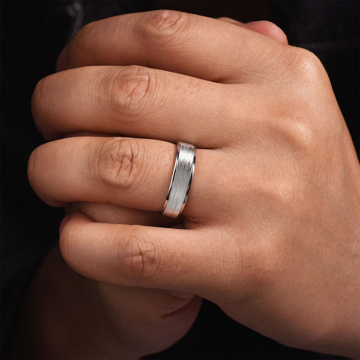 Gabriel & Co. Jacob Men's 6mm Brushed Finish Polished Edge Wedding Ring in 14K White Gold close-up detail
