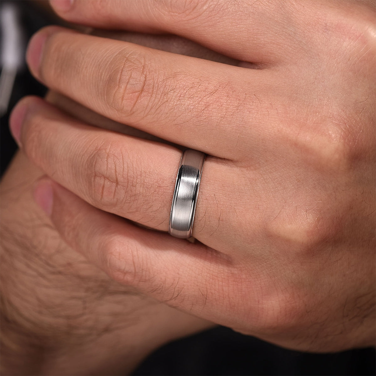 Gabriel & Co. Paul Men's 6mm Satin Finish Polished Edge Wedding Ring in 14K White Gold close-up detail