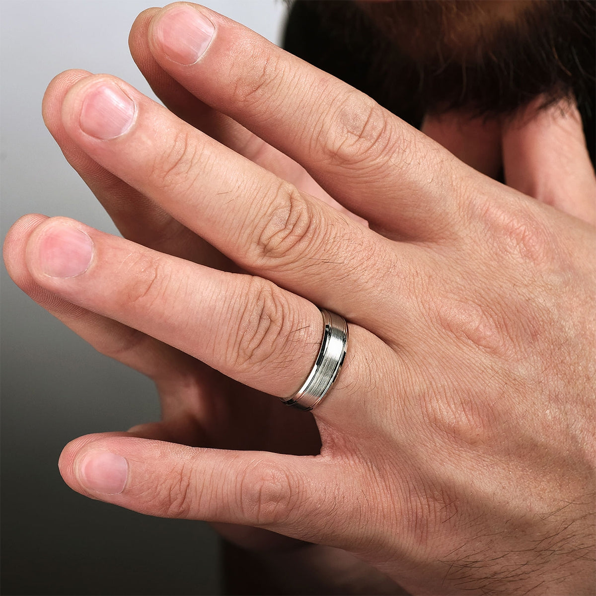 Gabriel & Co. Charles Men's 6mm Satin Finish Polished Edge Wedding Ring in 14K White Gold close-up detail