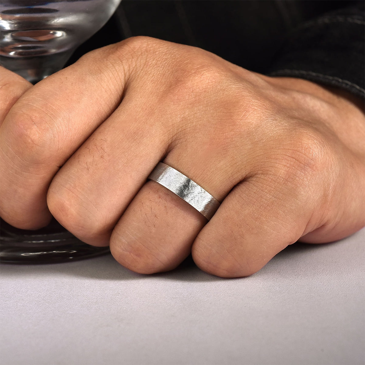 Gabriel & Co. Jaxson Men's 6mm Brushed Finish Flat Wedding Ring in 14K White Gold close-up detail