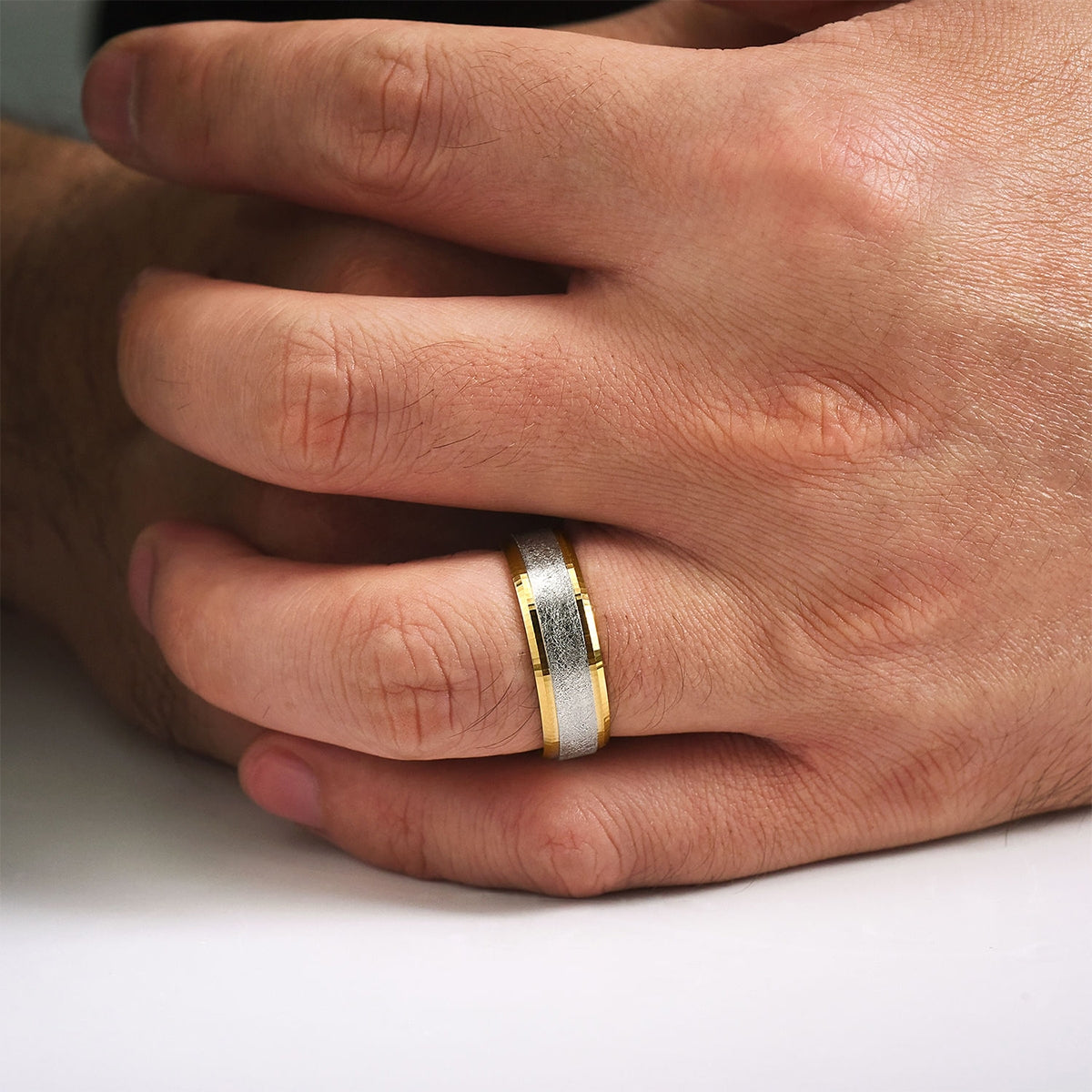 Gabriel & Co. Cole Men's 7mm Brushed Finish Beveled Edge Wedding Ring in 14K White & Yellow Gold close-up detail