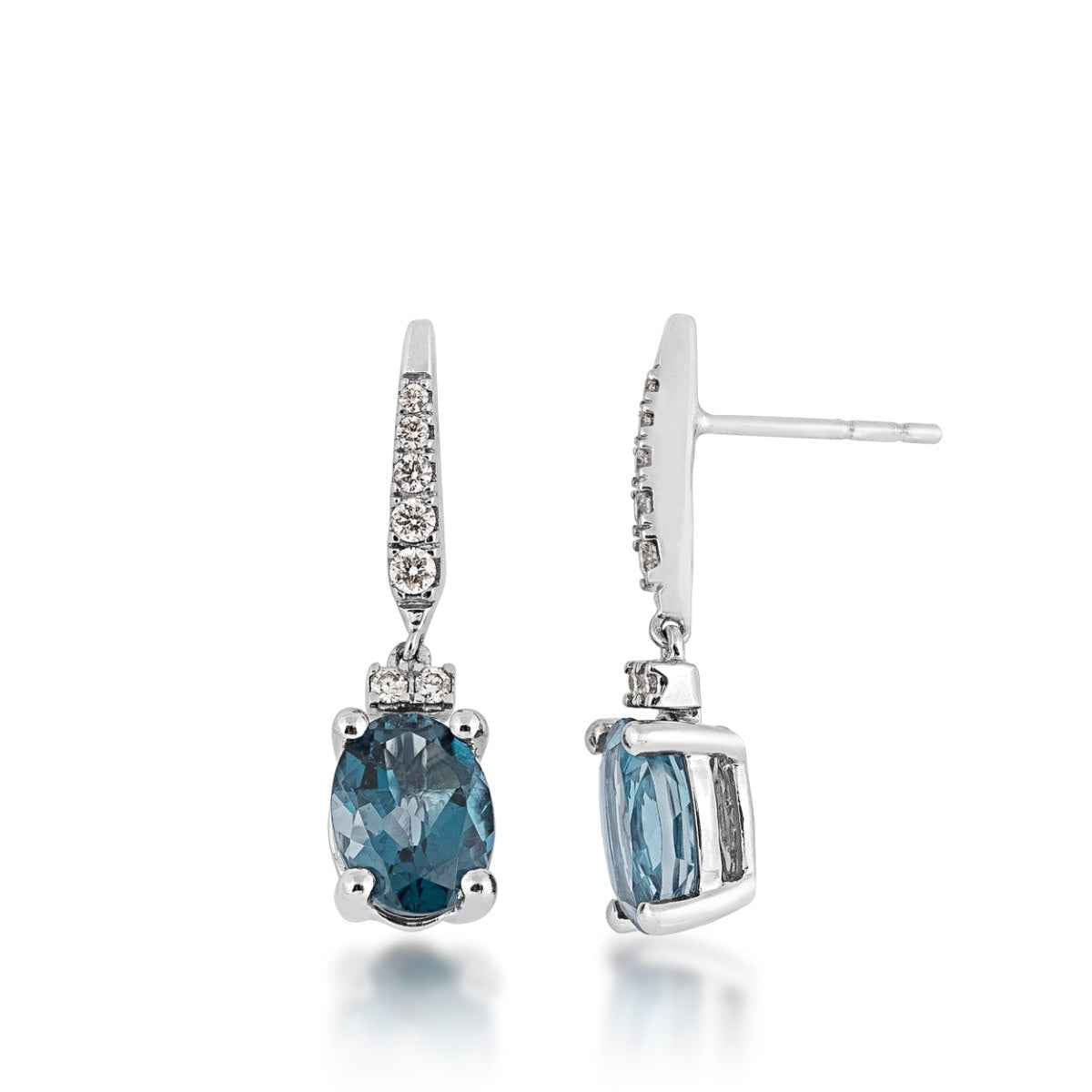 Oval London Blue Topaz & 1/5 ct. tw. Diamond Dangle Earrings in 10K White Gold