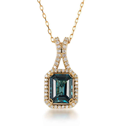 Emerald Cut London Blue Topaz & 1/4 ct. tw. Diamond Halo Pendant in 10K Yellow Gold