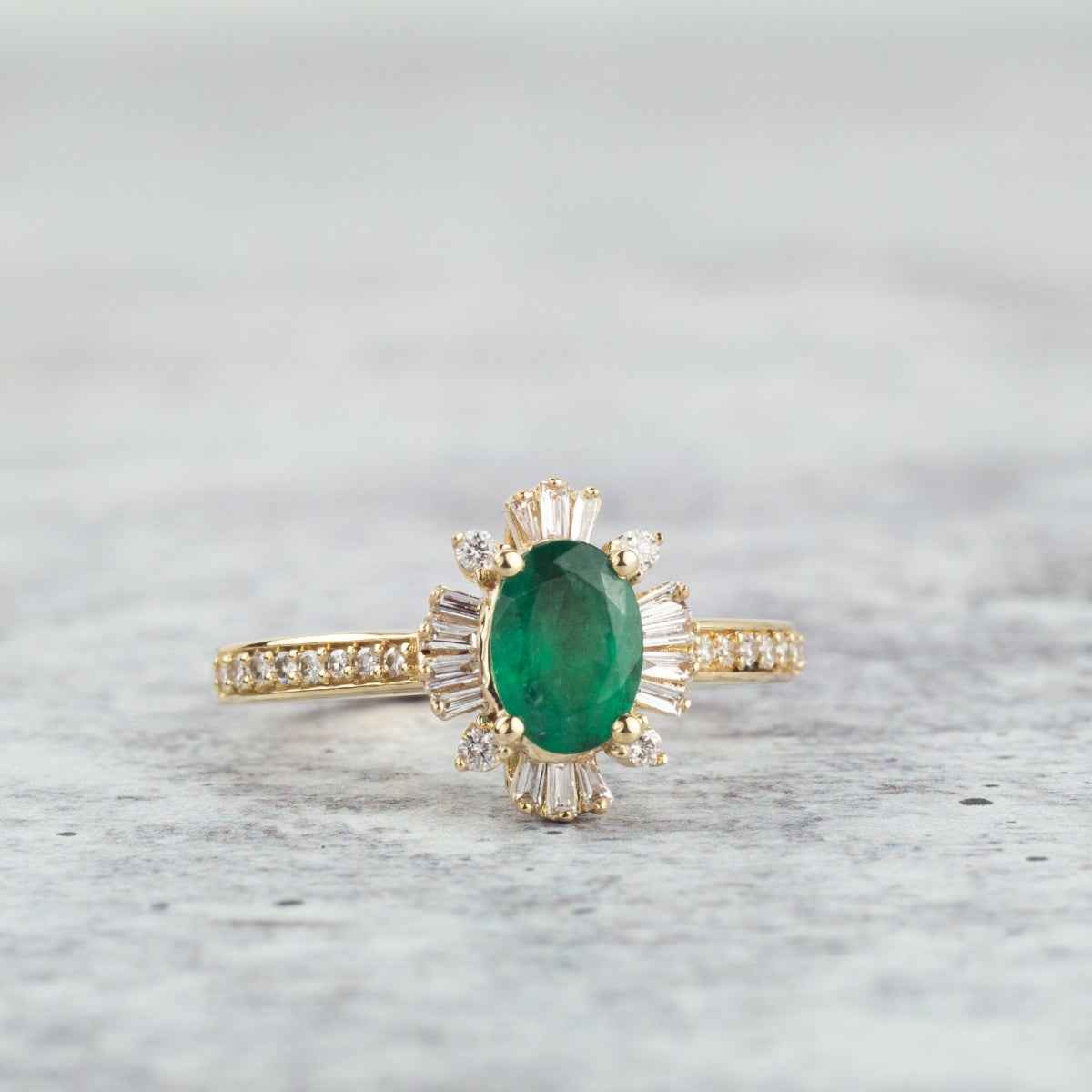 Oval Emerald and 1/4 ct. tw. Diamond Starburst Halo Ring in 10K Yellow Gold close-up detail