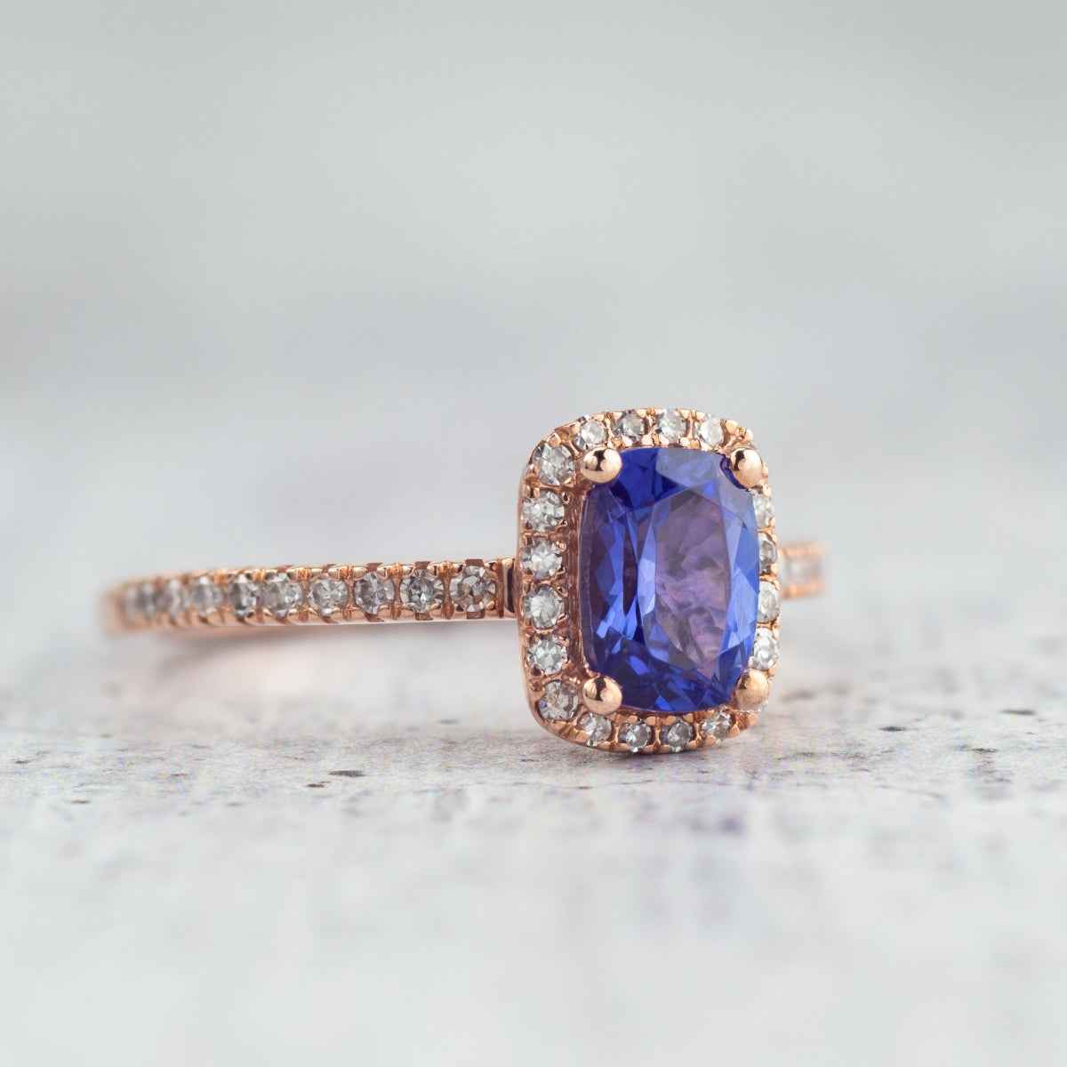 Cushion Tanzanite & 1/4 ct. tw. Diamond Halo Ring in 10K Pink Gold close-up detail
