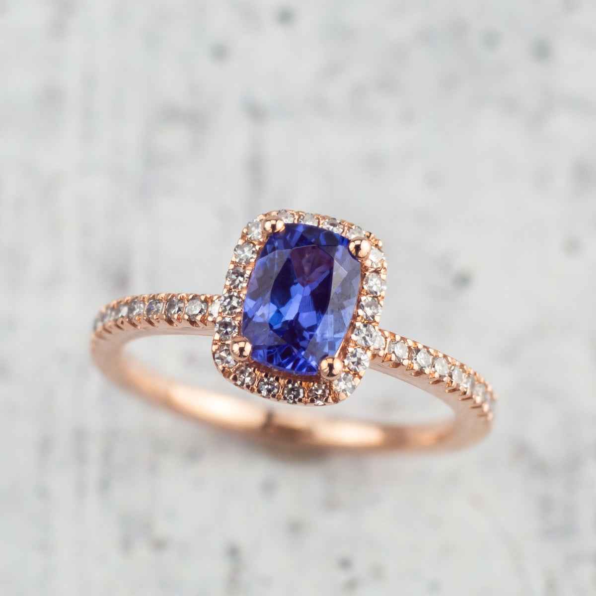 Cushion Tanzanite & 1/4 ct. tw. Diamond Halo Ring in 10K Pink Gold side profile