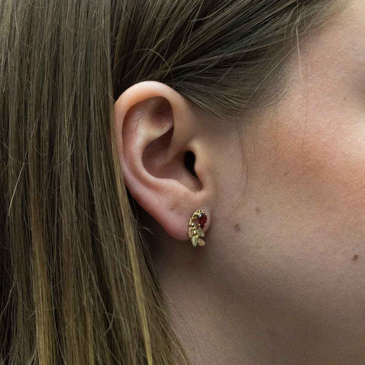 Black Hills Gold Pear Garnet & Leaf Branch Earrings in 10K Yellow Gold close-up detail