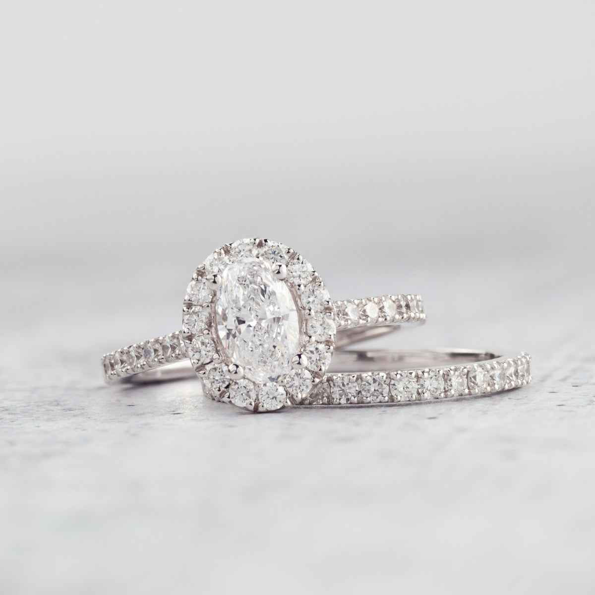 Natural 1-5/8 ct. tw. Oval Diamond Halo Wedding Set in 14K White Gold side profile