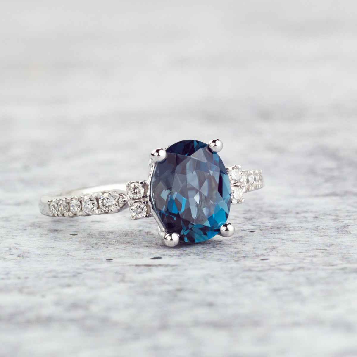 Oval London Blue Topaz and 1/5 ct. tw. Diamond Ring in 10K White Gold close-up detail