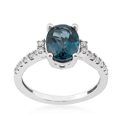 Oval London Blue Topaz and 1/5 ct. tw. Diamond Ring in 10K White Gold