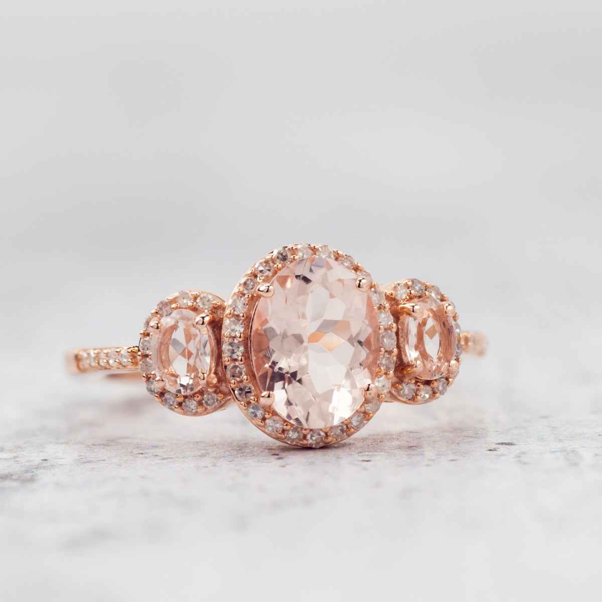 Oval Morganite & 1/5 ct. tw. Diamond Halo 3-Stone Ring in 10K Pink Gold close-up detail