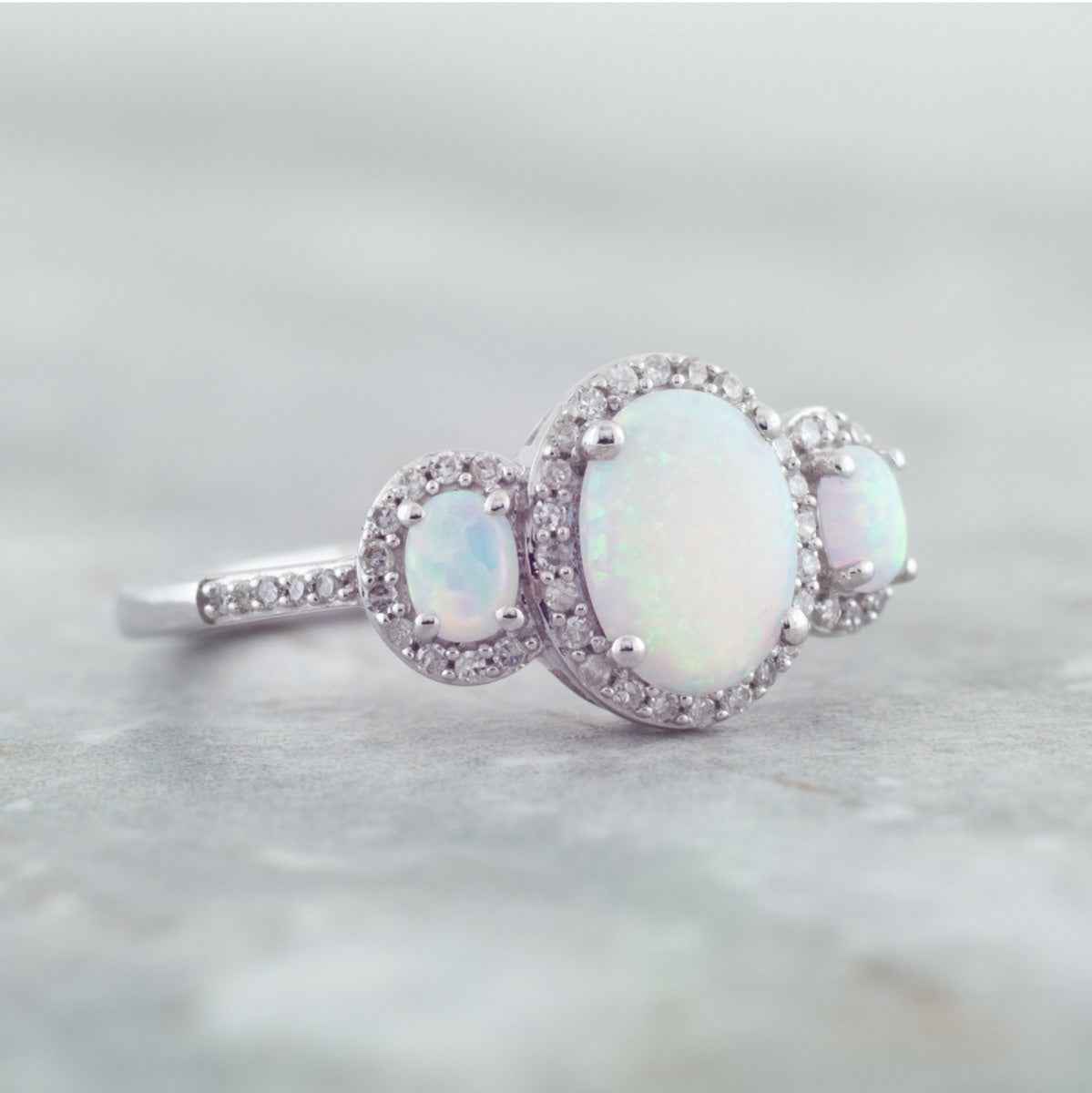 3-Stone Created Oval Opal & 1/5 ct. tw. Diamond Halo Ring in 10K White Gold close-up detail