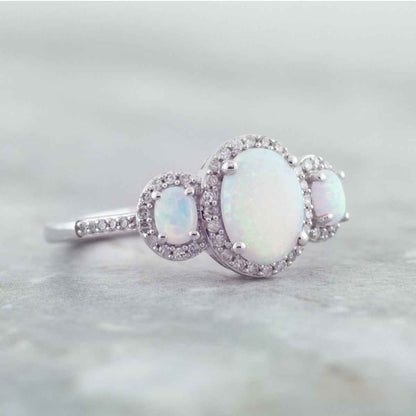 3-Stone Created Oval Opal & 1/5 ct. tw. Diamond Halo Ring in 10K White Gold close-up detail