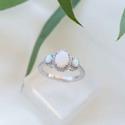 3-Stone Created Oval Opal & 1/5 ct. tw. Diamond Halo Ring in 10K White Gold side profile