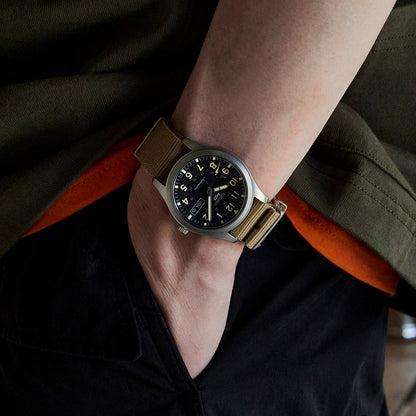 Seiko Men's 5 Sports Field Automatic Stainless Steel Watch with Black Dial & Tan Nylon Strap close-up detail