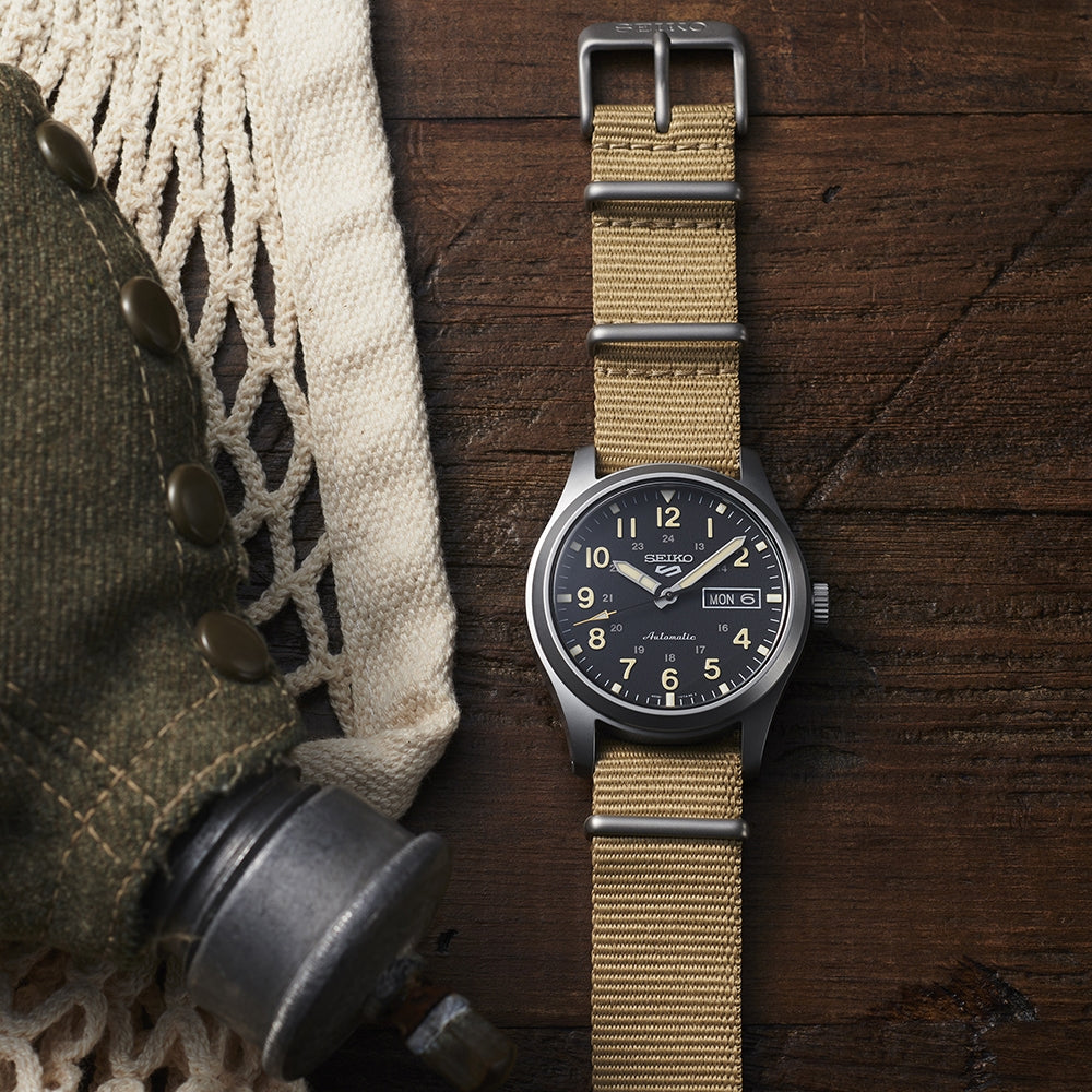 Seiko Men's 5 Sports Field Automatic Stainless Steel Watch with Black Dial & Tan Nylon Strap front view