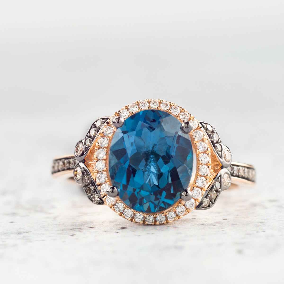 Le Vian Chocolatier Oval Deep Sea Blue Topaz & 1/4 ct. tw. Chocolate & Vanilla Diamond Halo Ring in 14K Strawberry front view