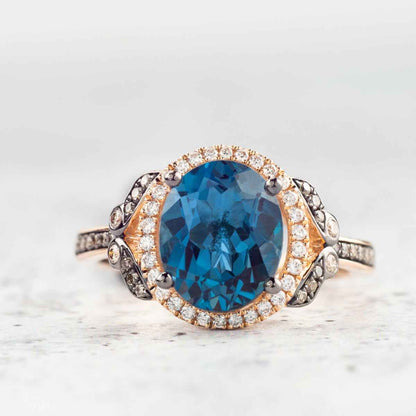Le Vian Chocolatier Oval Deep Sea Blue Topaz & 1/4 ct. tw. Chocolate & Vanilla Diamond Halo Ring in 14K Strawberry front view