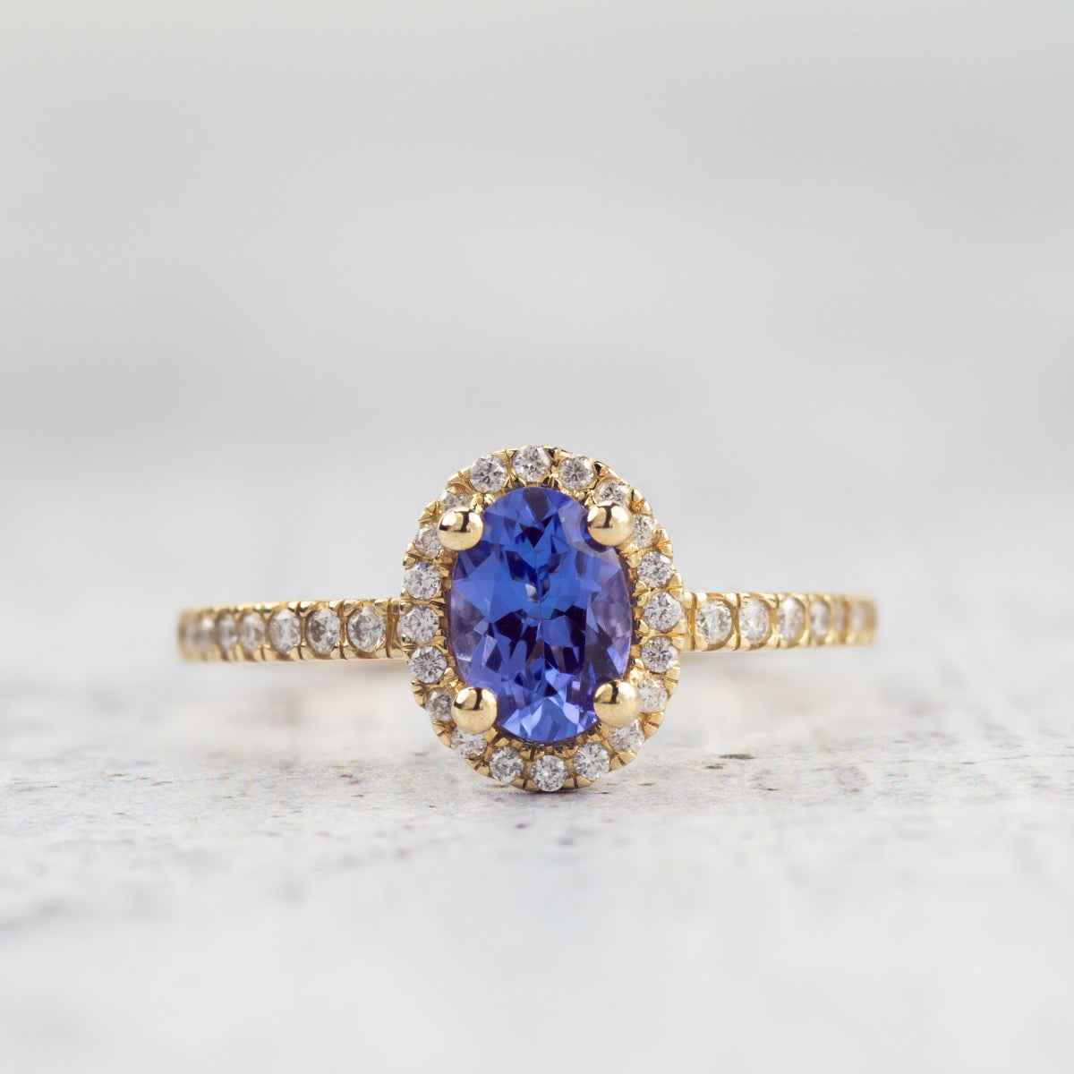 Oval Tanzanite & 1/5 ct. tw. Diamond Halo Ring in 14K Yellow Gold front view
