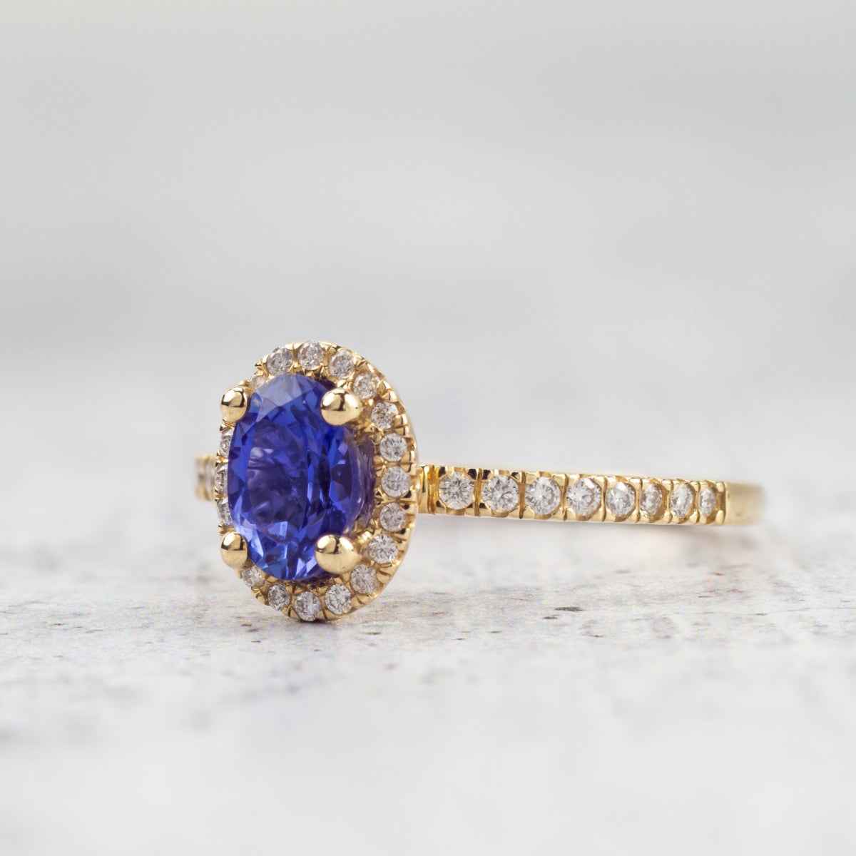 Oval Tanzanite & 1/5 ct. tw. Diamond Halo Ring in 14K Yellow Gold close-up detail