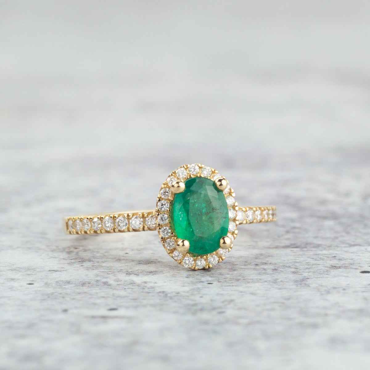 Oval Emerald & 1/5 ct. tw. Diamond Halo Ring in 14K Yellow Gold front view