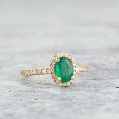 Oval Emerald & 1/5 ct. tw. Diamond Halo Ring in 14K Yellow Gold front view