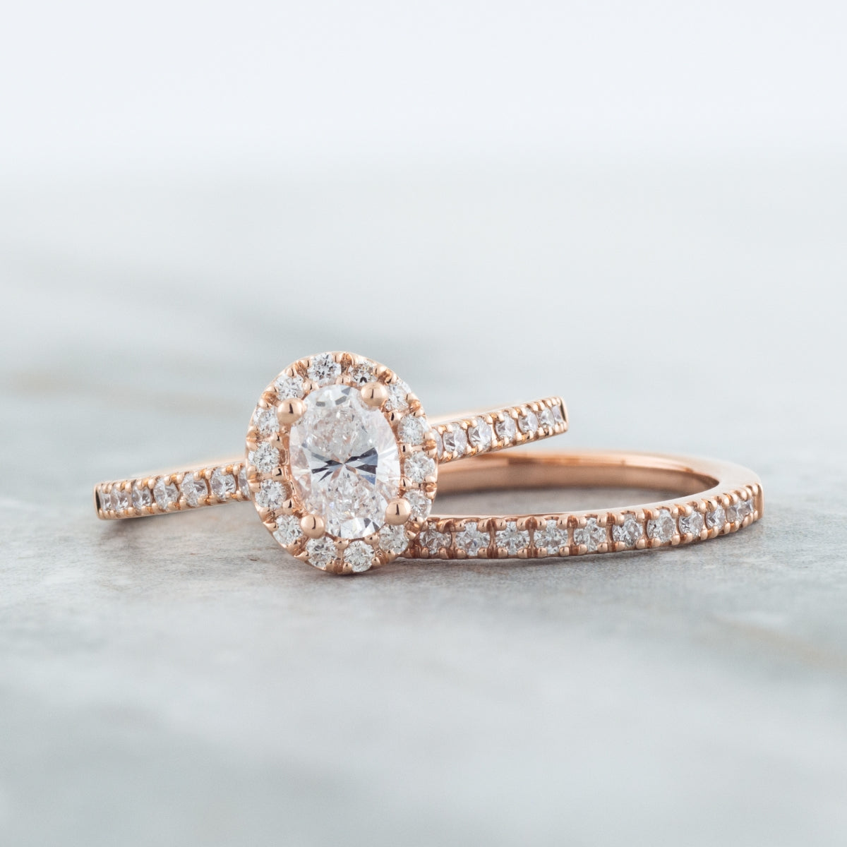 Natural 1 ct. tw. Oval Diamond Halo Wedding Set in 14K Pink Gold full view