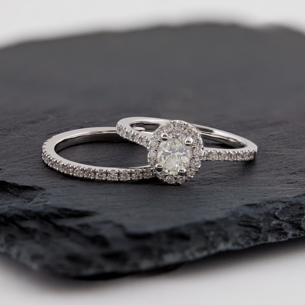 Natural 1 ct. tw. Oval Diamond Halo Wedding Set in 14K White Gold side profile