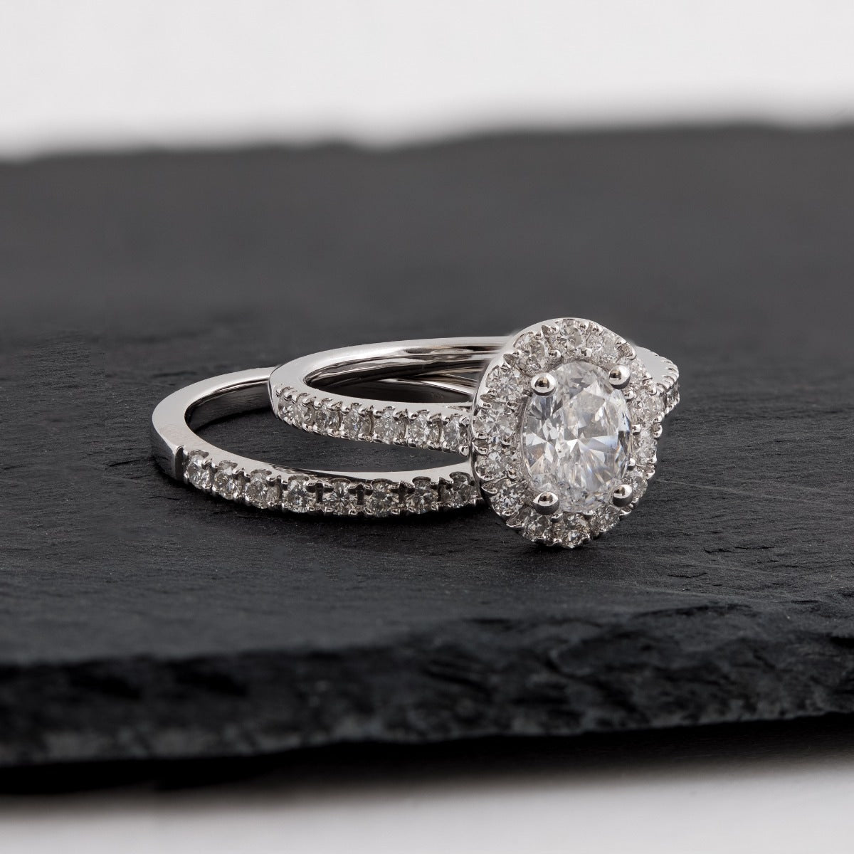 Natural 2 ct. tw. Oval Diamond Halo Wedding Set in 14K White Gold side profile