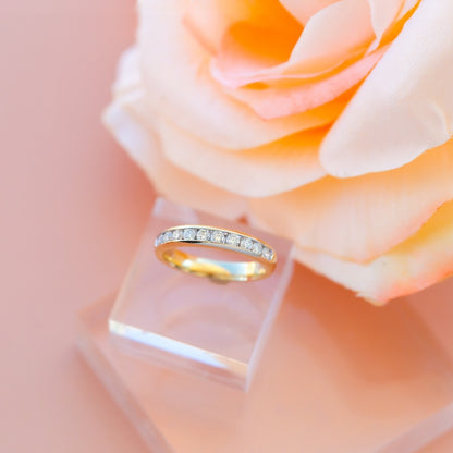 1/2 ct. tw. Round Brilliant Diamond Channel Set Anniversary Ring in 14K Yellow Gold close-up detail