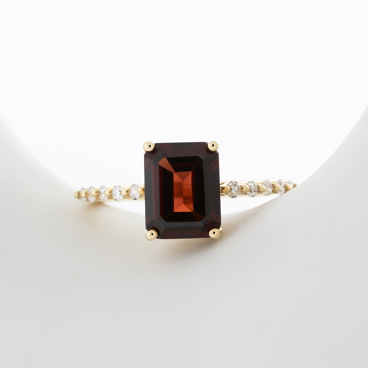 Emerald Cut Garnet & 1/6 ct. tw. Diamond Ring in 10K Yellow Gold full view