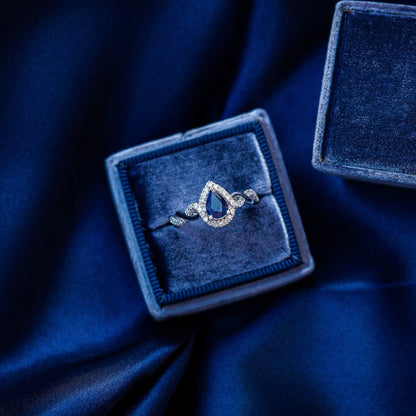 Infinite Love Pear Sapphire & 1/5 ct. tw. Diamond Halo Twist Ring in 10K White Gold side profile