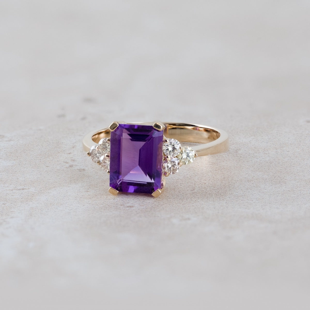 Emerald Cut Amethyst & 1/3 ct. tw. Diamond Ring in 14K Yellow Gold close-up detail
