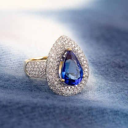 Pear Tanzanite & 2 ct. tw. Diamond Triple Halo Ring in 14K Yellow Gold close-up detail