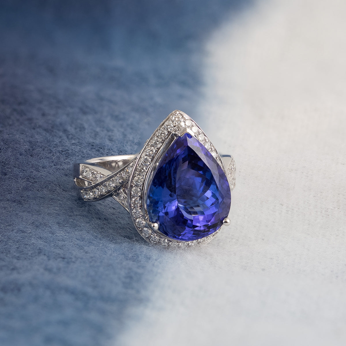 Pear Tanzanite & 7/8 ct. tw. Diamond Halo Twist Ring in 14K White Gold close-up detail