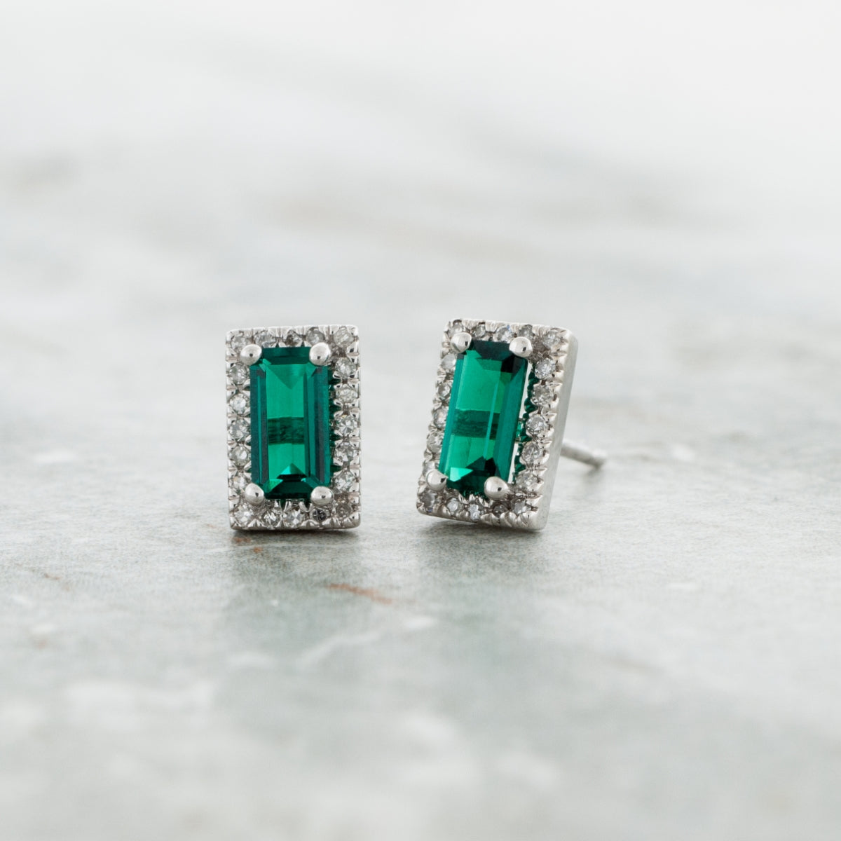 Created Emerald Cut Emerald & 1/8 ct. tw. Diamond Halo Earrings in 10K White Gold front view